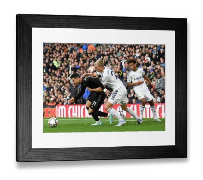Framed Print : Leeds United vs. Arsenal: Martinelli Faces Off Against Kristensen in Premier League Clash Framed Print : Leeds United vs. Arsenal: Martinelli Faces Off Against Kristensen in Premier League Clash