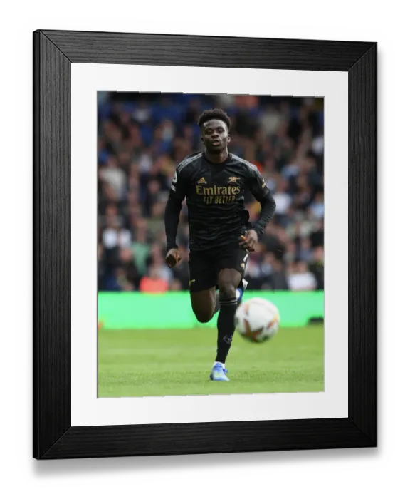 Framed Print : Bukayo Saka in Action: Leeds United vs. Arsenal FC, Premier League 2022-23