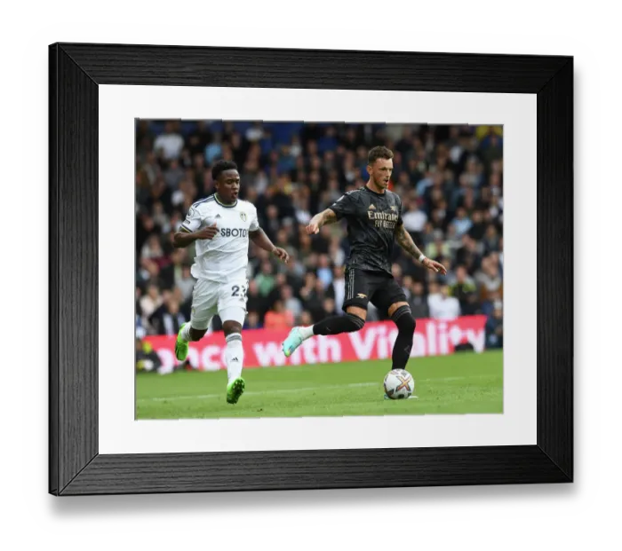 Framed Print : Intense Face-off: Ben White vs. Luis Sinisterra - Arsenal vs. Leeds United, Premier League 2022-23