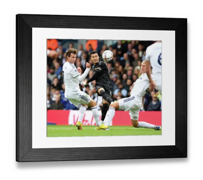Framed Print : Martinelli Faces Off Against Leeds Defenders in Arsenal's Premier League Battle Framed Print : Martinelli Faces Off Against Leeds Defenders in Arsenal's Premier League Battle