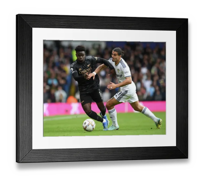 Framed Print : Saka vs Struijk: A Premier League Battle - Arsenal's Bukayo Saka Goes Head-to-Head with Leeds Pascal Struijk Framed Print : Saka vs Struijk: A Premier League Battle - Arsenal's Bukayo Saka Goes Head-to-Head with Leeds Pascal Struijk