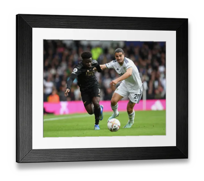 Framed Print : Saka vs Struijk: A Premier League Showdown - Battle of the Wings: Arsenal's Bukayo Saka Clashes with Leeds Pascal Struijk Framed Print : Saka vs Struijk: A Premier League Showdown - Battle of the Wings: Arsenal's Bukayo Saka Clashes with Leeds Pascal Struijk