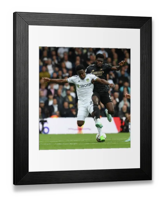 Framed Print : Thomas Partey vs Luis Sinisterra: Intense Battle in Leeds United vs Arsenal FC Premier League Clash Framed Print : Thomas Partey vs Luis Sinisterra: Intense Battle in Leeds United vs Arsenal FC Premier League Clash