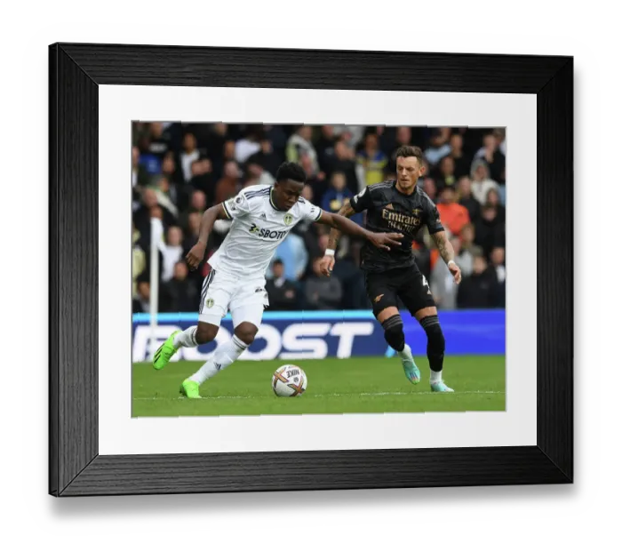 Framed Print : Arsenal's Ben White Shuts Down Leeds Luis Sinisterra in Premier League Clash Framed Print : Arsenal's Ben White Shuts Down Leeds Luis Sinisterra in Premier League Clash