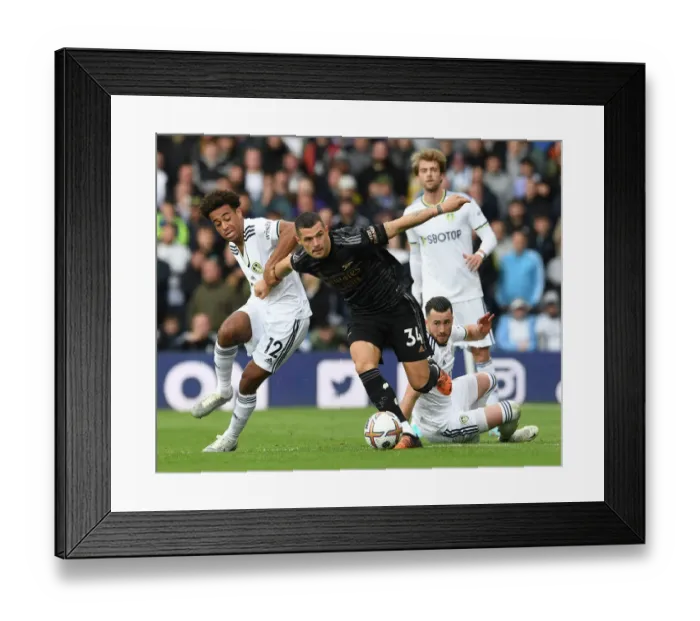 Framed Print : Xhaka Stands Firm: Leeds United vs. Arsenal FC, Premier League Showdown
