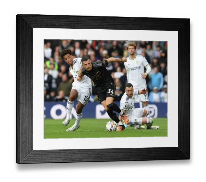 Framed Print : Xhaka Takes on Leeds Duo in Intense Arsenal-Leeds Clash (2022-23 Premier League)