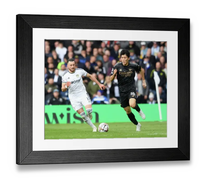 Framed Print : Leeds United vs. Arsenal: Intense Battle – Tomiyasu Under Pressure