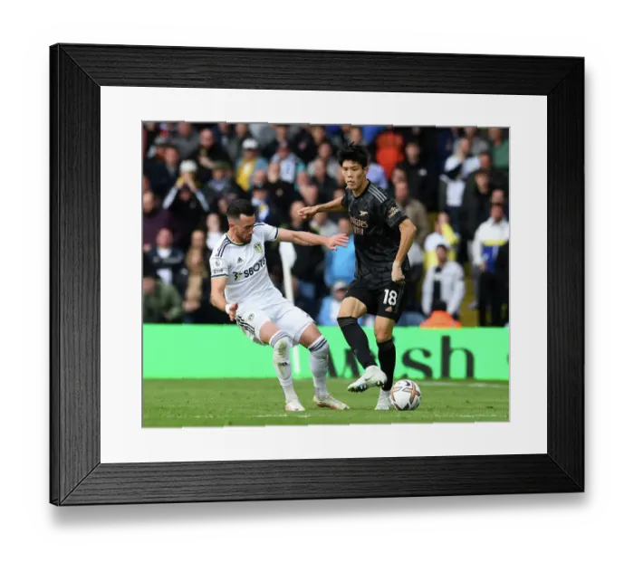 Framed Print : Intense Battle: Tomiyasu Under Pressure - Leeds United vs Arsenal (2022-23)
