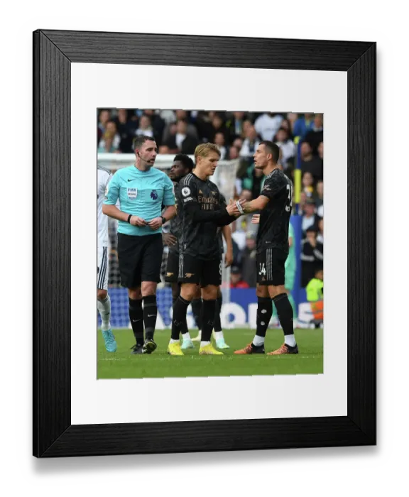Framed Print : Arsenal's Granit Xhaka Receives Captain's Armband from Martin Odegaard against Leeds United (2022-23)