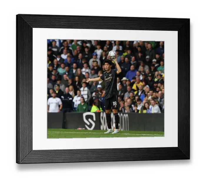 Framed Print : Arsenal's Tomiyasu Faces Off Against Leeds in Premier League Showdown Framed Print : Arsenal's Tomiyasu Faces Off Against Leeds in Premier League Showdown