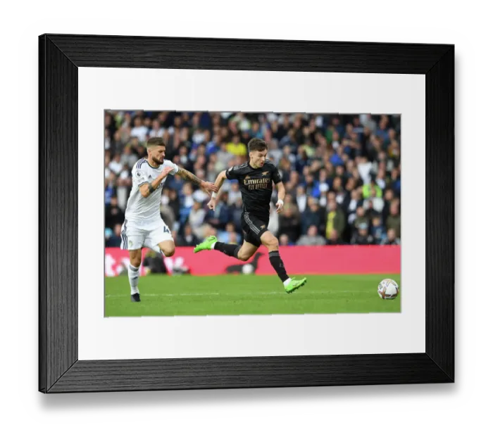 Framed Print : Clash of Styles: Kieran Tierney vs Mateusz Klich - Leeds United vs Arsenal FC, Premier League 2022-23