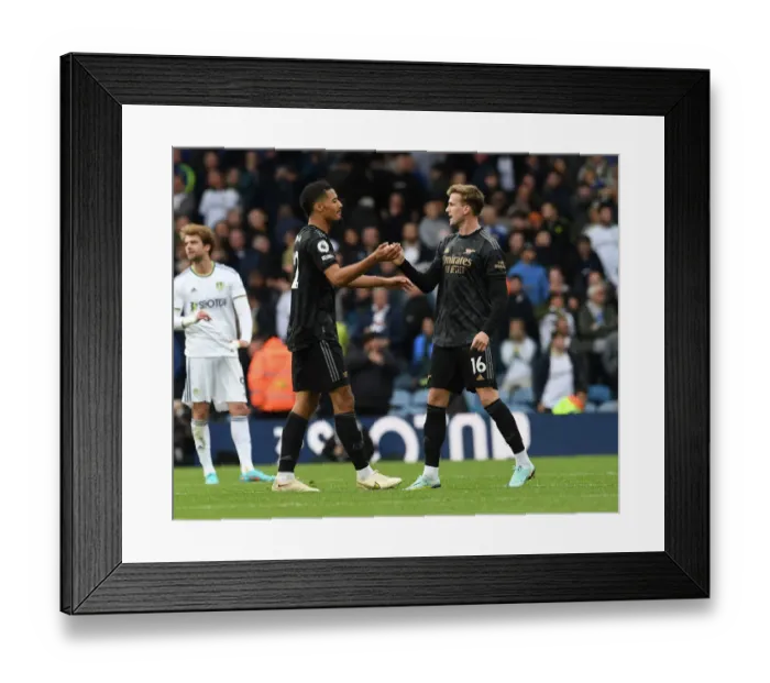 Framed Print : Arsenal Celebrate Hard-Fought Victory Over Leeds United in Premier League