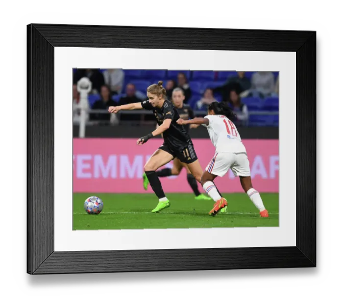 Framed Print : Champions League Showdown: Olympique Lyonnais vs. Arsenal Women - Miedema Takes On Sombath