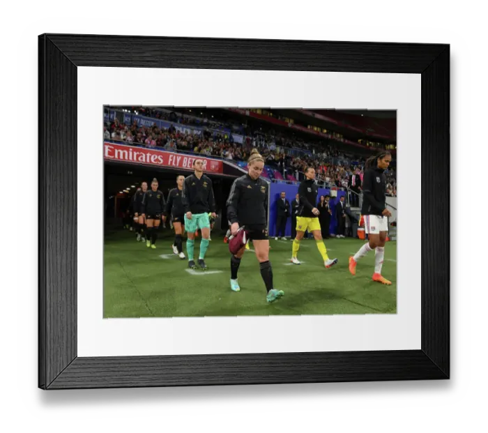 Framed Print : Arsenal Women Face Off Against Olympique Lyonnais in UEFA Champions League Clash