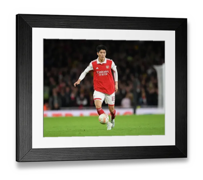 Framed Print : Arsenal's Tomiyasu Stars: Arsenal vs PSV Eindhoven, Europa League 2022-23