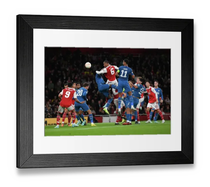 Framed Print : Magalhaes vs. Gakpo: A Europa League Showdown at Arsenal's Emirates Stadium