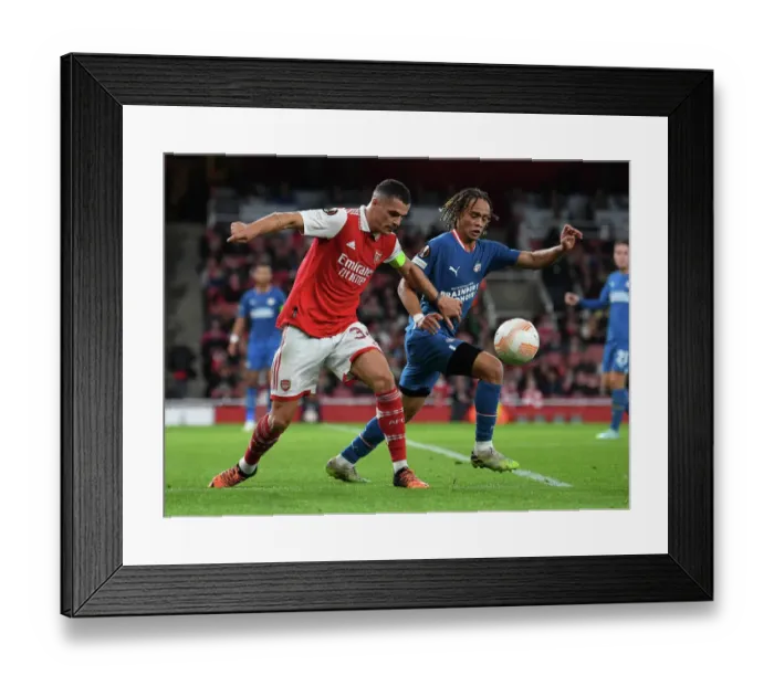 Framed Print : Arsenal vs PSV Eindhoven: Granit Xhaka Clashes with Xavi Simons in Europa League Showdown Framed Print : Arsenal vs PSV Eindhoven: Granit Xhaka Clashes with Xavi Simons in Europa League Showdown
