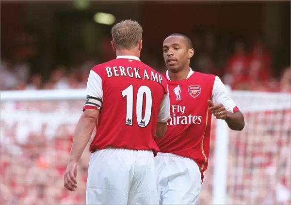 Thierry Henry celebrates scoring with Dennis Bergkamp