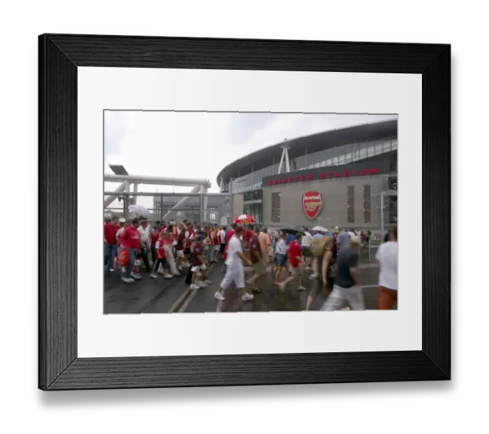 Framed Print : Arsenal fans cross the North Bridge to get to Emirates Stadium