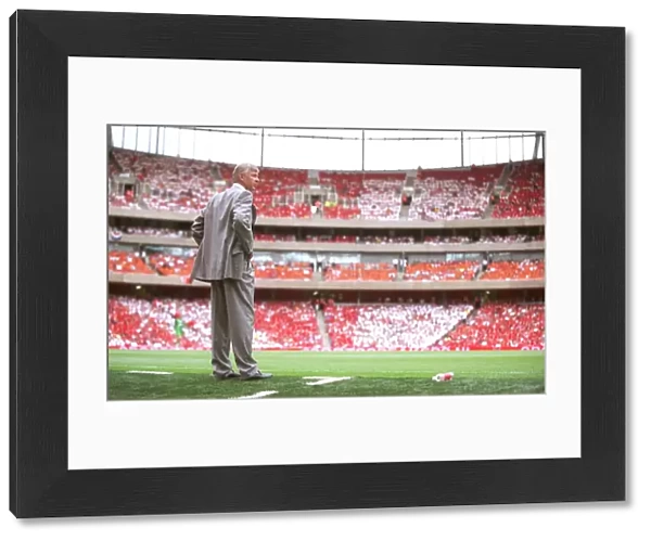 Arsene Wenger the Arsenal Manager at the edge of his technical area
