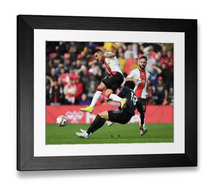 Framed Print : Clash at St. Mary's: Tomiyasu vs. Elyounoussi in Southampton v Arsenal Premier League Showdown