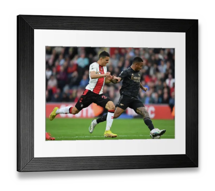 Framed Print : Gabriel Jesus Outmaneuvers Mo Elyounoussi: Arsenal's Thrilling Victory Over Southampton in the Premier League 2022-23 Framed Print : Gabriel Jesus Outmaneuvers Mo Elyounoussi: Arsenal's Thrilling Victory Over Southampton in the Premier League 2022-23