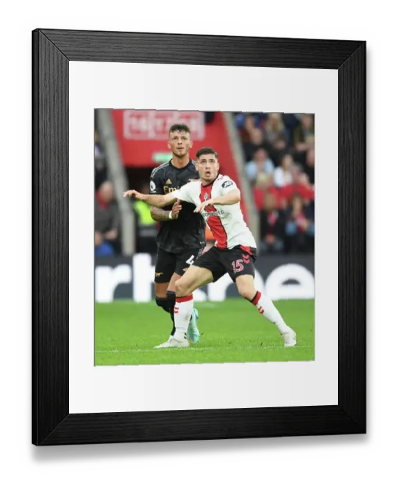 Framed Print : Clash at St. Mary's: Arsenal's Ben White Faces Off Against Southampton's Romain Perraud in Premier League Showdown