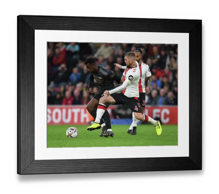 Framed Print : Arsenal's Nketiah Outsmarts Southampton's Lyanco: A Premier League Showdown Framed Print : Arsenal's Nketiah Outsmarts Southampton's Lyanco: A Premier League Showdown