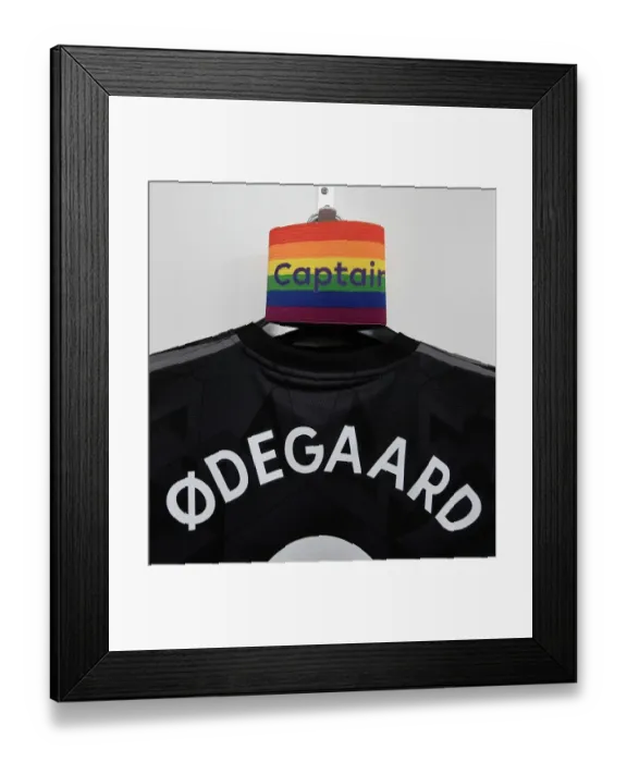 Framed Print : Odegaard Prepares for Southampton Clash: Captain's Shirt and Armband in Arsenal Changing Room