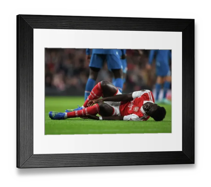 Framed Print : Arsenal's Bukayo Saka Suffers Injury in Arsenal vs PSV Europa League Clash (2022-23) Framed Print : Arsenal's Bukayo Saka Suffers Injury in Arsenal vs PSV Europa League Clash (2022-23)