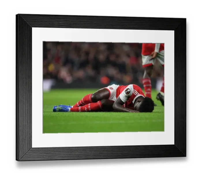 Framed Print : Arsenal's Bukayo Saka Suffers Injury in Arsenal vs PSV Europa League Match (2022-23) Framed Print : Arsenal's Bukayo Saka Suffers Injury in Arsenal vs PSV Europa League Match (2022-23)