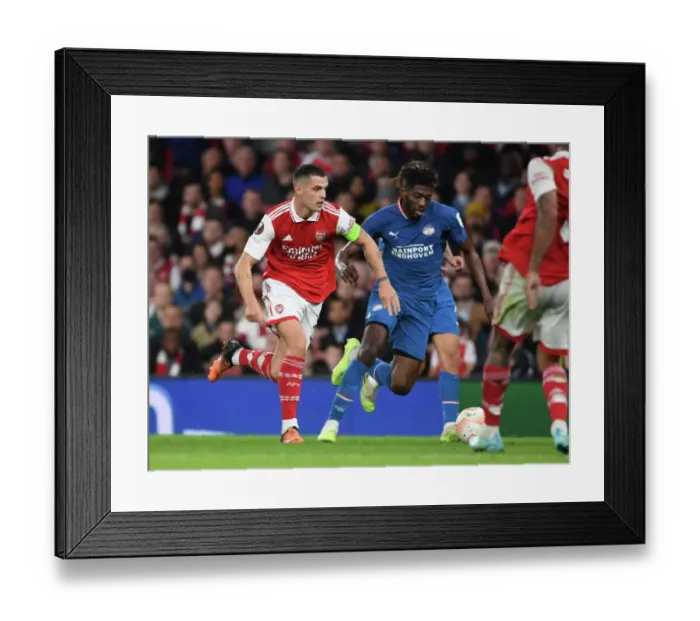 Framed Print : Granit Xhaka's Dominant Midfield Display: Arsenal Secures Europa League Victory over PSV Eindhoven