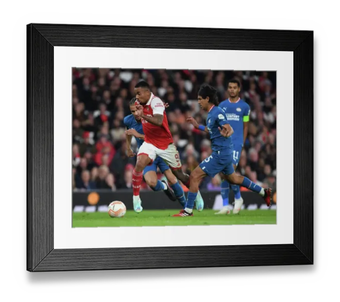 Framed Print : Arsenal's Gabriel Jesus Outmaneuvers PSV's Erick Gutierrez in Europa League Clash Framed Print : Arsenal's Gabriel Jesus Outmaneuvers PSV's Erick Gutierrez in Europa League Clash