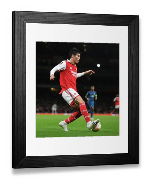 Framed Print : Arsenal's Tomiyasu Stars: Arsenal vs PSV Eindhoven, UEFA Europa League 2022-23