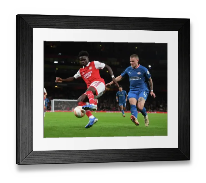 Framed Print : Bukayo Saka vs. Philipp Max: Arsenal's Battle with PSV Eindhoven in Europa League Group A Framed Print : Bukayo Saka vs. Philipp Max: Arsenal's Battle with PSV Eindhoven in Europa League Group A