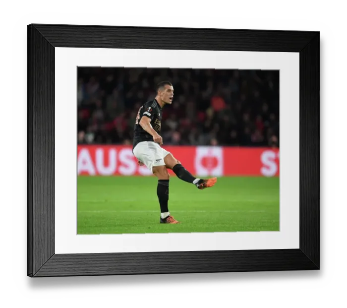 Framed Print : Granit Xhaka's Standout Midfield Display: Arsenal's Dominant Performance against PSV Eindhoven in Europa League