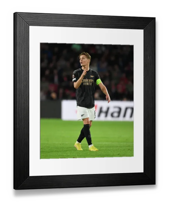 Framed Print : Martin Odegaard in Action: Arsenal vs. PSV Eindhoven - UEFA Europa League (2022-23) Framed Print : Martin Odegaard in Action: Arsenal vs. PSV Eindhoven - UEFA Europa League (2022-23)