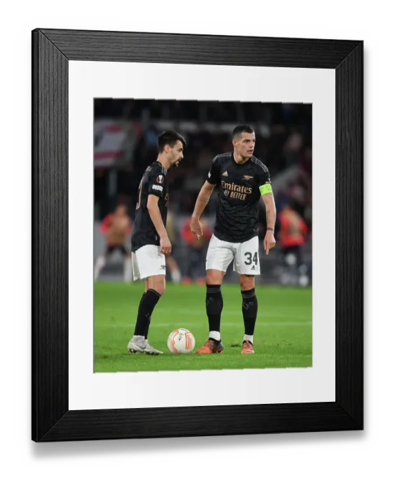 Framed Print : Fabio Vieira and Granit Xhaka Clash in Europa League: PSV Eindhoven vs. Arsenal (2022-23) Framed Print : Fabio Vieira and Granit Xhaka Clash in Europa League: PSV Eindhoven vs. Arsenal (2022-23)