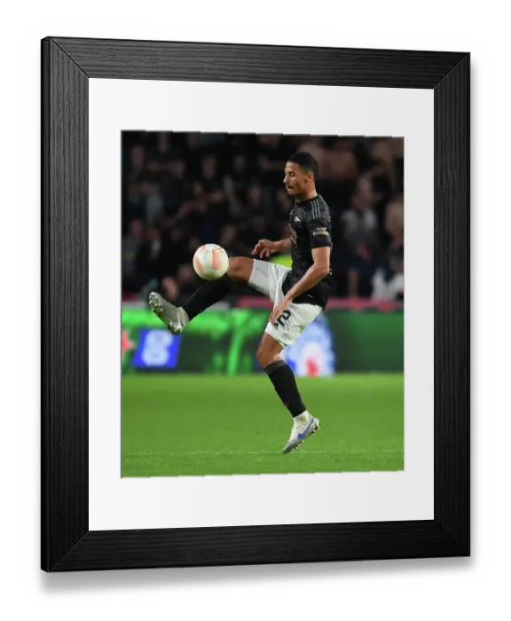 Framed Print : William Saliba vs PSV Eindhoven: Arsenal's Defender in Europa League Showdown Framed Print : William Saliba vs PSV Eindhoven: Arsenal's Defender in Europa League Showdown