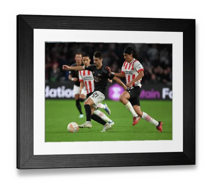 Framed Print : Fabio Vieira Breaks Past PSV's Erick Gutierrez in Arsenal's UEFA Europa League Clash (PSV Eindhoven vs Arsenal 2022-23)
