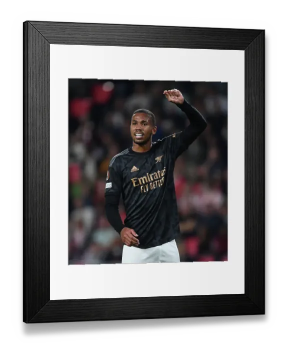 Framed Print : Gabriel's Showdown: Arsenal vs PSV Eindhoven in Europa League Battle