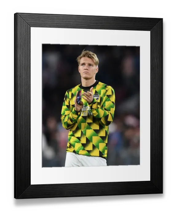 Framed Print : Arsenal's Martin Odegaard Celebrates with Fans after Europa League Victory over PSV Eindhoven Framed Print : Arsenal's Martin Odegaard Celebrates with Fans after Europa League Victory over PSV Eindhoven