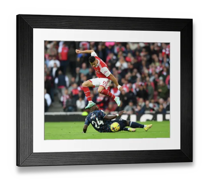 Framed Print : Martinelli vs. Aurier: A Premier League Battle at Emirates Stadium - Arsenal vs. Nottingham Forest (2022-23)