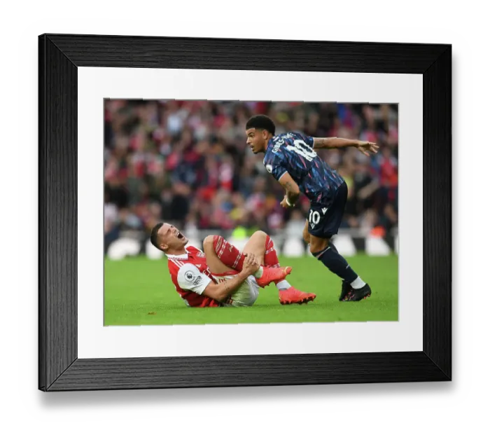 Framed Print : Arsenal's Xhaka Injured in Intense Clash with Nottingham Forest's Gibbs-White Framed Print : Arsenal's Xhaka Injured in Intense Clash with Nottingham Forest's Gibbs-White
