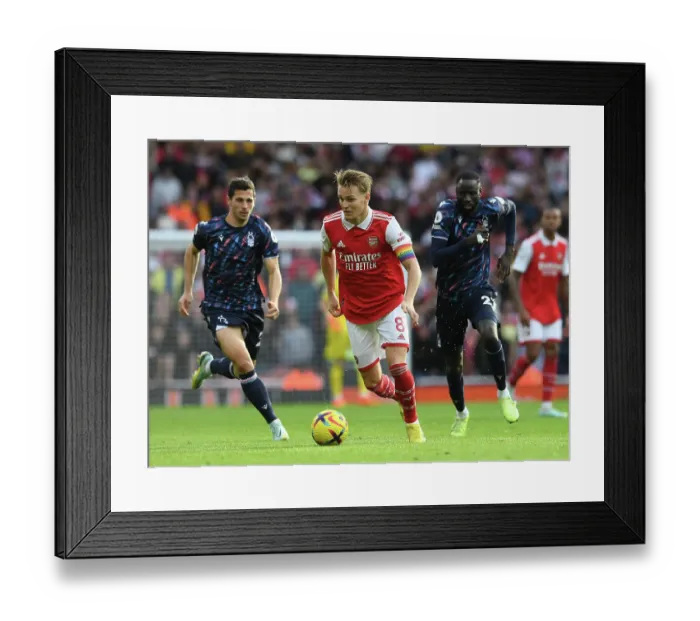 Framed Print : Martin Odegaard's Brilliant Display: Arsenal's Dominant Win Against Nottingham Forest in the Premier League