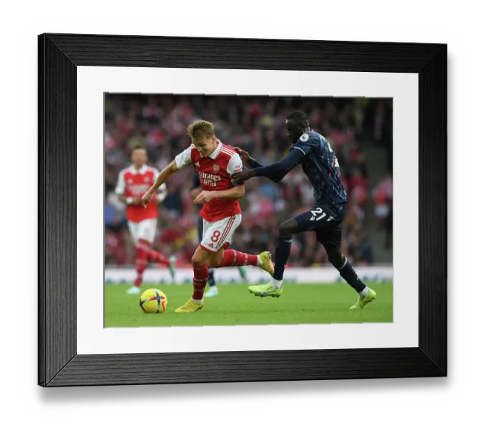 Framed Print : Clash of the Midfield Titans: Odegaard vs. Kouyate - Arsenal vs. Nottingham Forest Showdown