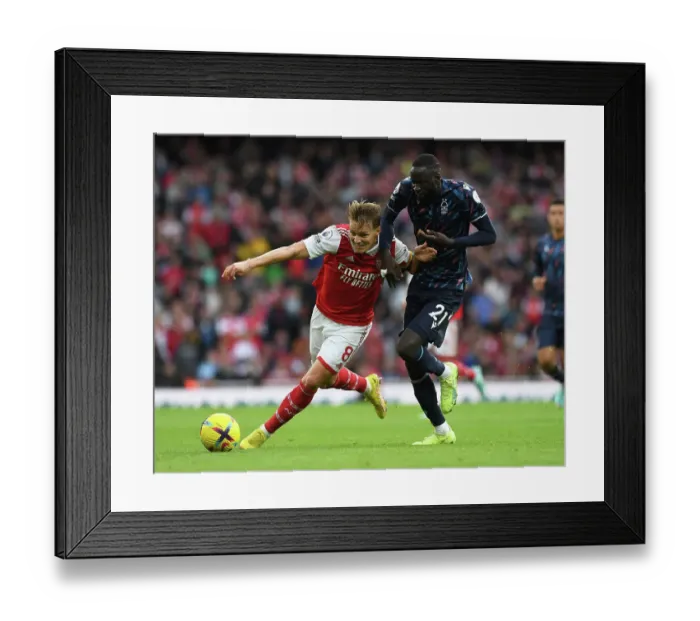 Framed Print : Arsenal vs. Nottingham Forest: Martin Odegaard Clashes with Cheikhou Kouyate in the 2022-23 Premier League Framed Print : Arsenal vs. Nottingham Forest: Martin Odegaard Clashes with Cheikhou Kouyate in the 2022-23 Premier League