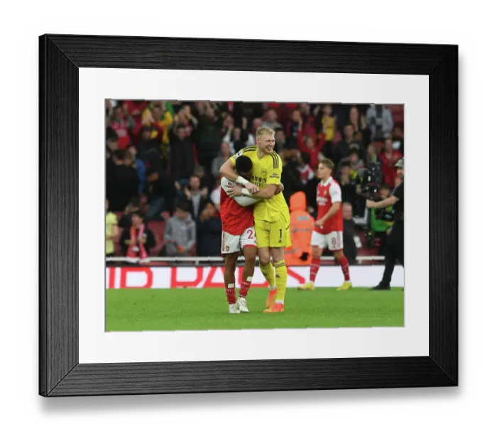 Framed Print : Arsenal's Nelson and Ramsdale Celebrate Victory Over Nottingham Forest in 2022-23 Premier League