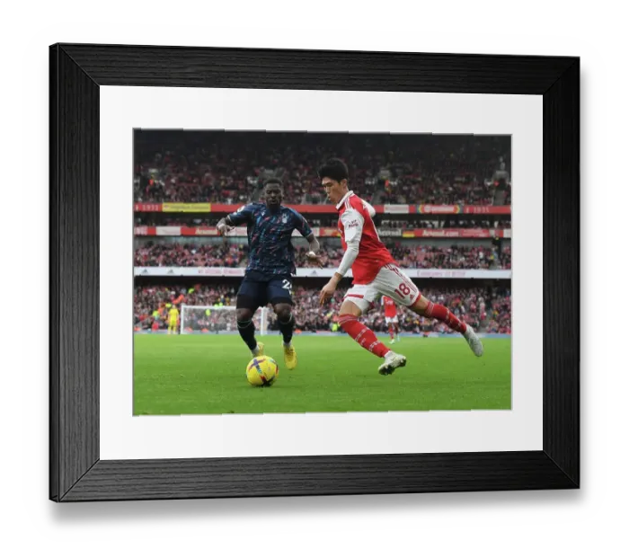 Framed Print : Arsenal's Tomiyasu Outruns Aurier in Premier League Clash vs. Nottingham Forest Framed Print : Arsenal's Tomiyasu Outruns Aurier in Premier League Clash vs. Nottingham Forest
