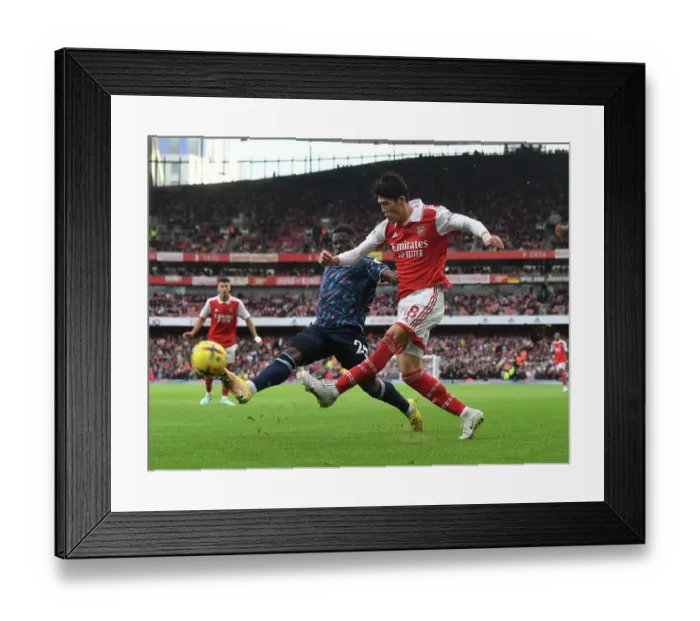 Framed Print : Tomiyasu's Game-Winning Sprint: Arsenal Outpaces Nottingham Forest